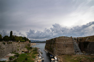 Panoramic view of historical new fortress in kerkyra at corfu against cloudy sky
