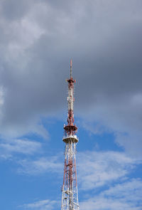 Low angle view of communications tower against sky