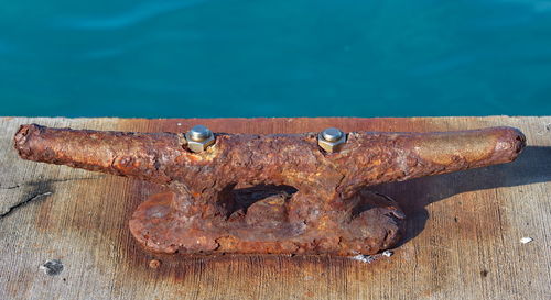 Close-up of rusty metal on wood