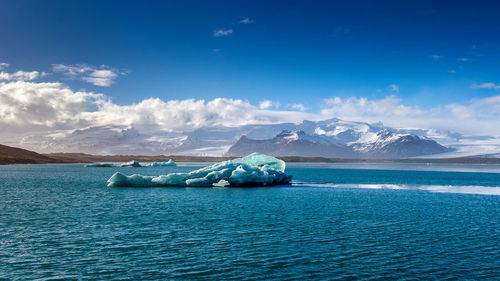 Scenic view of sea against blue sky