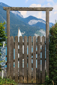 View of wooden fence against mountain range