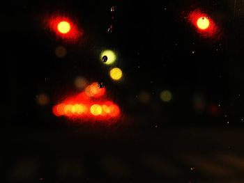 Defocused image of illuminated lights at night