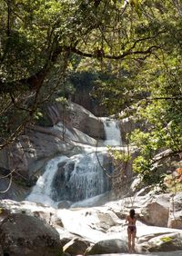 Full length of man against waterfall