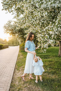 Side view of woman standing on field