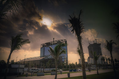 Panoramic view of soccer field against sky at sunset