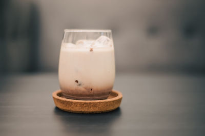 Close-up of illuminated candle on table