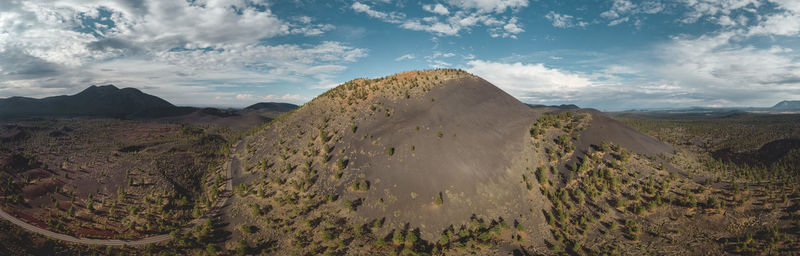 Panoramic view of landscape against cloudy sky