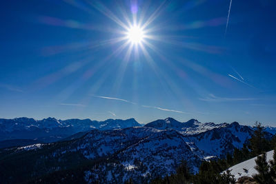 Scenic view of snowcapped mountains against sky