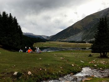 Scenic view of mountains against cloudy sky