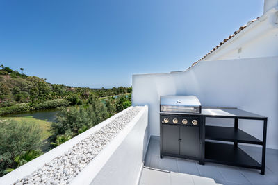 Low angle view of buildings against clear blue sky
