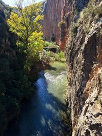 Scenic view of waterfall against sky