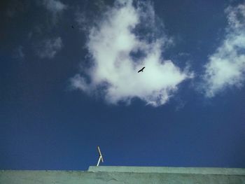 Low angle view of airplane flying in sky