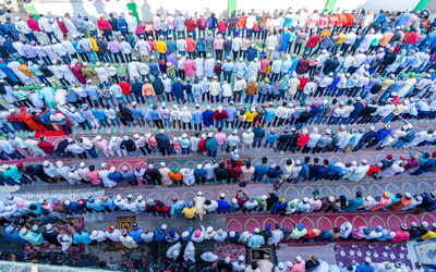 High angle view of crowd praying on road