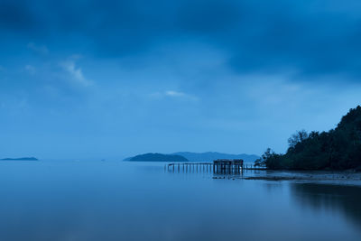 Scenic view of lake against blue sky during dusk