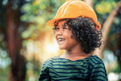 Portrait of smiling man standing outdoors