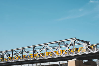 Germany, berlin, underground train passing bridge