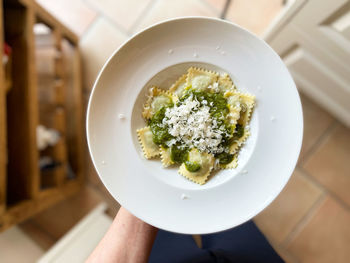 High angle view of person holding food