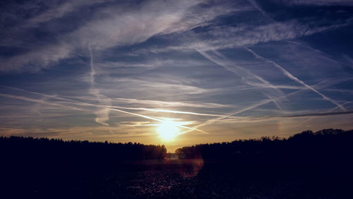 Scenic view of silhouette landscape against sky during sunset