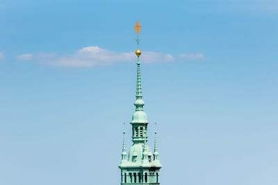 Low angle view of communications tower against sky