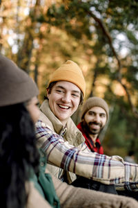 Happy man enjoying during camping with friends