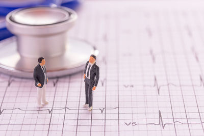 High angle view of people on paper