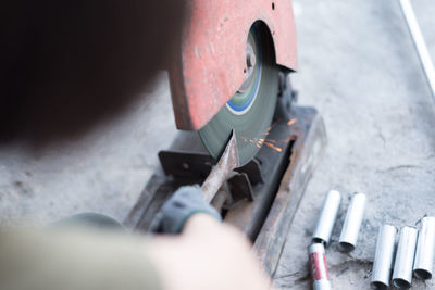 High angle view of man working in machine