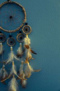 Dreamcatcher against blue wall