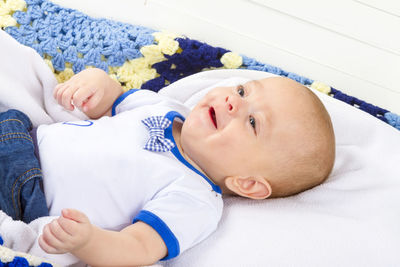 Cute baby lying on bed