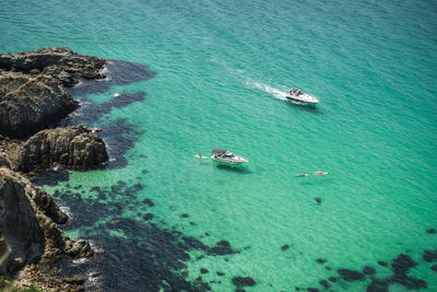 Pleasure boats approaching beautiful bounty lagoon, cape fiolent in balaklava, sevastopol, russia. 