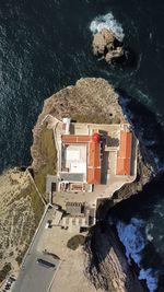 High angle view of townscape by sea