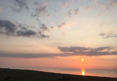 Scenic view of sea at sunset