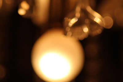 Close-up of illuminated light bulb