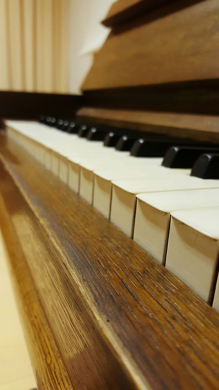 indoors, wood - material, table, close-up, book, wooden, still life, wood, education, selective focus, home interior, focus on foreground, piano, no people, absence, music, paper, high angle view, empty, arts culture and entertainment