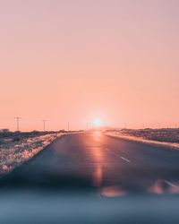 Road against sky during sunset