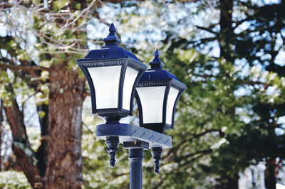 Low angle view of street light against sky