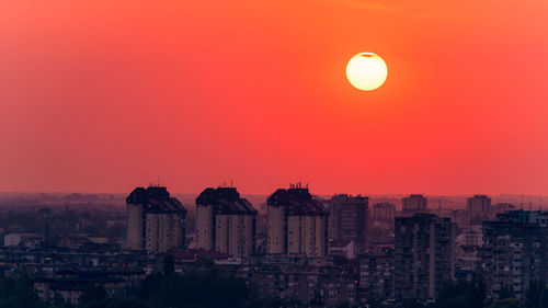 High angle view of buildings against sky during sunset