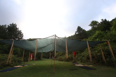 Clothes drying on clothesline against sky
