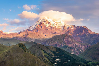 Scenic view of snowcapped mountains against sky