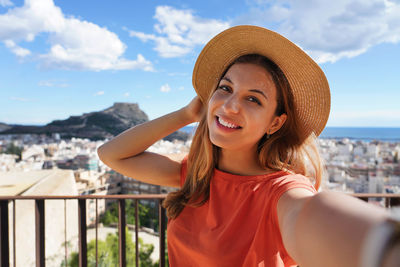 Girl takes self portrait in alicante, spain