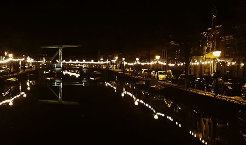 View of illuminated harbor at night