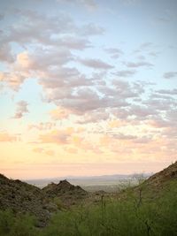 Scenic view of field against sky during sunset