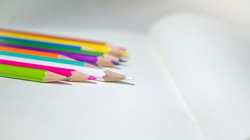 High angle view of multi colored pencils on table