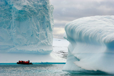 Scenic view of sea against sky during winter