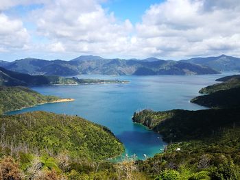 Scenic view of lake against cloudy sky