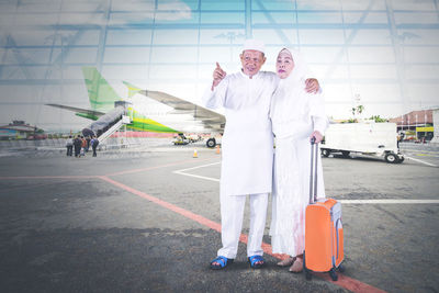 People standing on airport runway