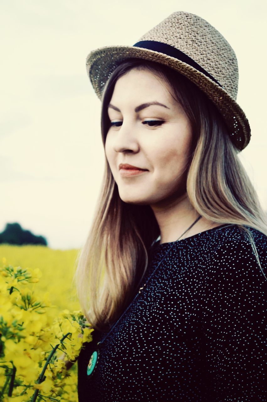 one person, hat, clothing, young adult, lifestyles, real people, young women, leisure activity, hair, portrait, women, headshot, beauty, adult, casual clothing, looking away, looking, focus on foreground, hairstyle, beautiful woman, contemplation