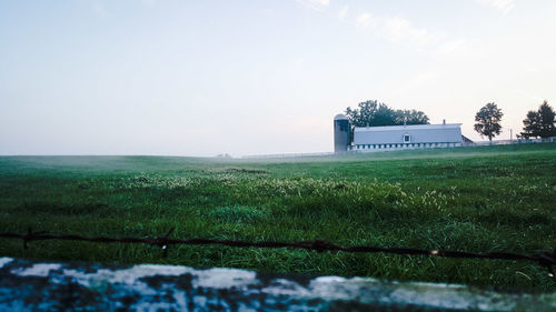 Built structure on field against sky