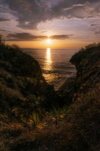 Scenic view of sea against sky during sunset