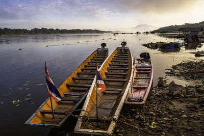 Boats moored at harbor