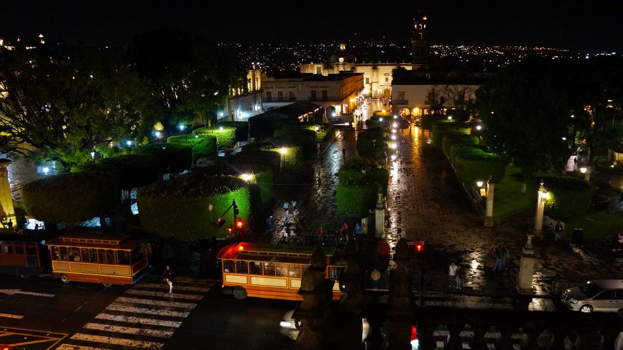 night, illuminated, building exterior, architecture, city, built structure, high angle view, transportation, building, cityscape, street, no people, city life, water, lighting equipment, road, residential district, mode of transportation, nature, motor vehicle, light